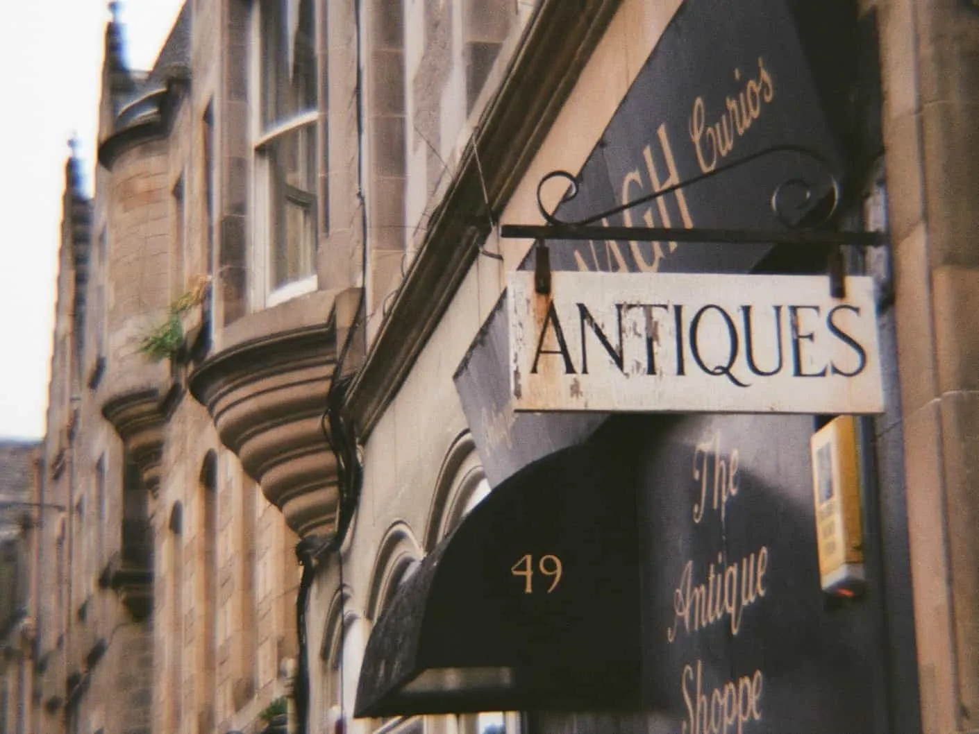 antiques sign above shop