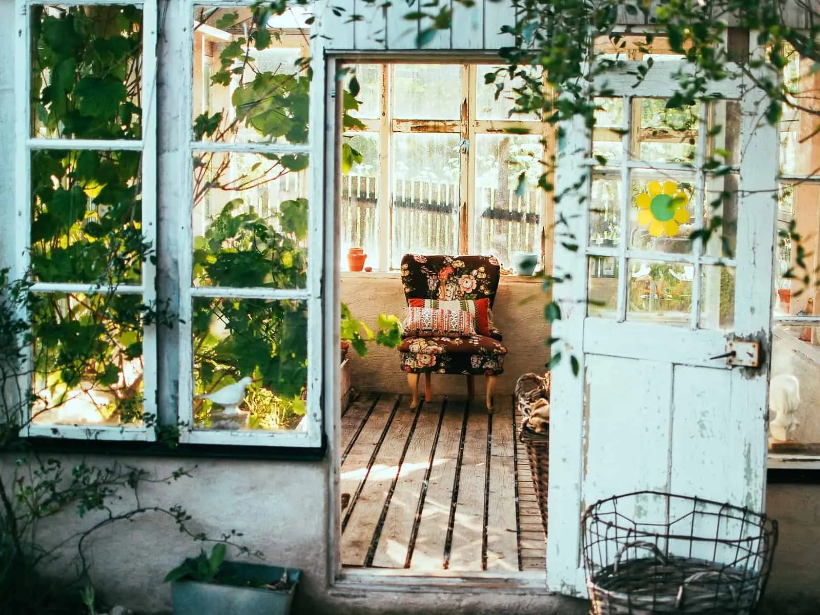 A sunroom with wooden door and windows