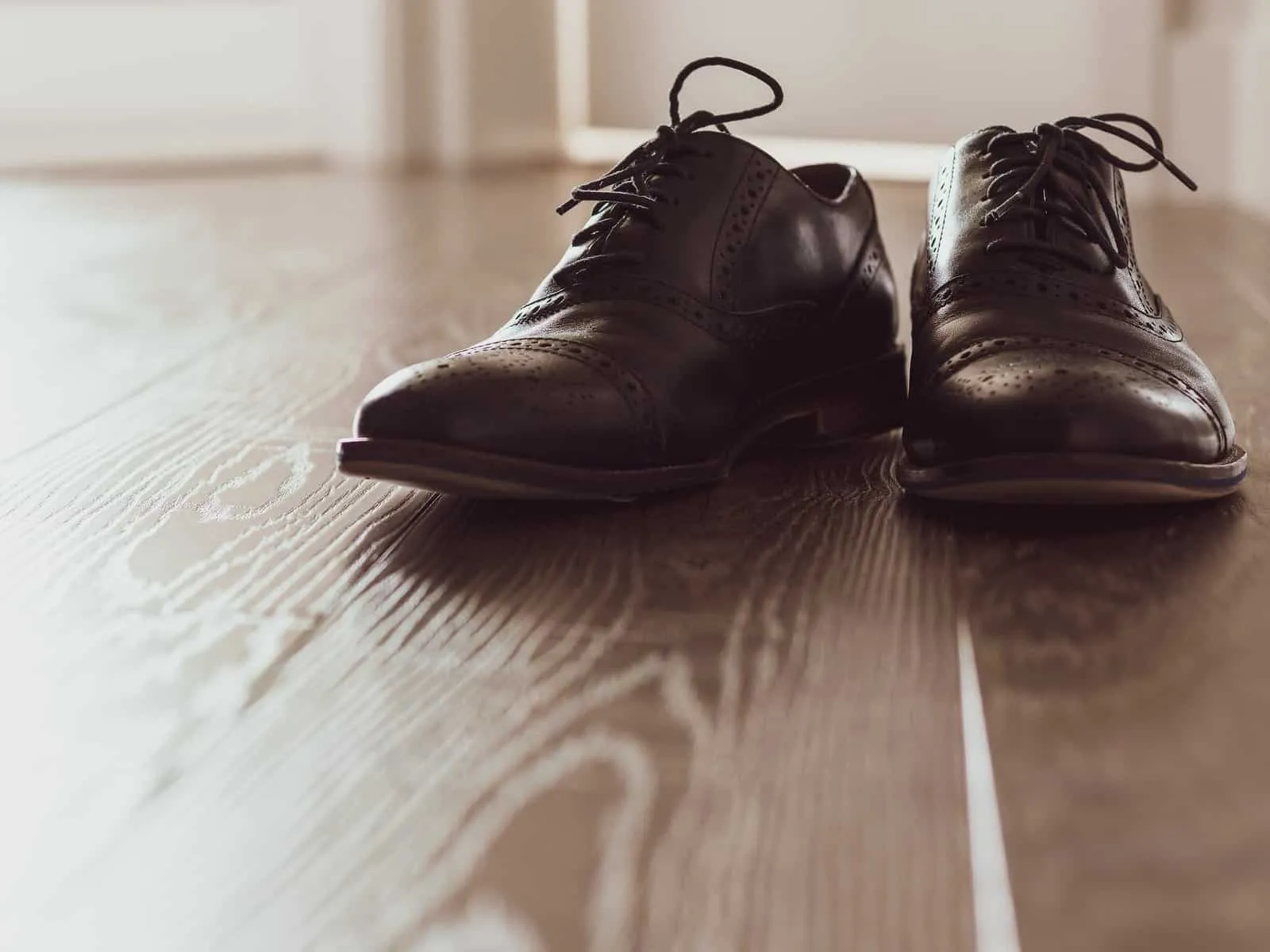 Pair of shoes on a wooden floor