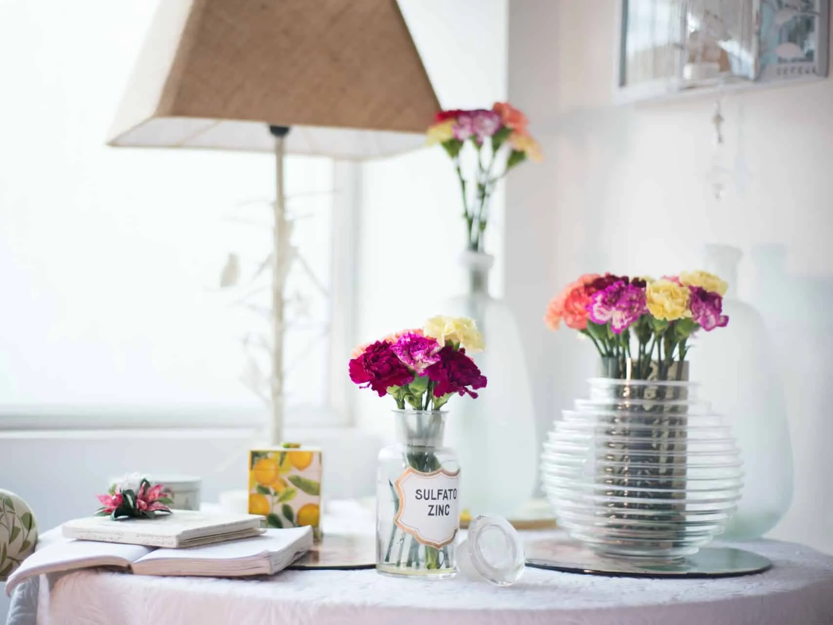 Glass vases of small flower bunches
