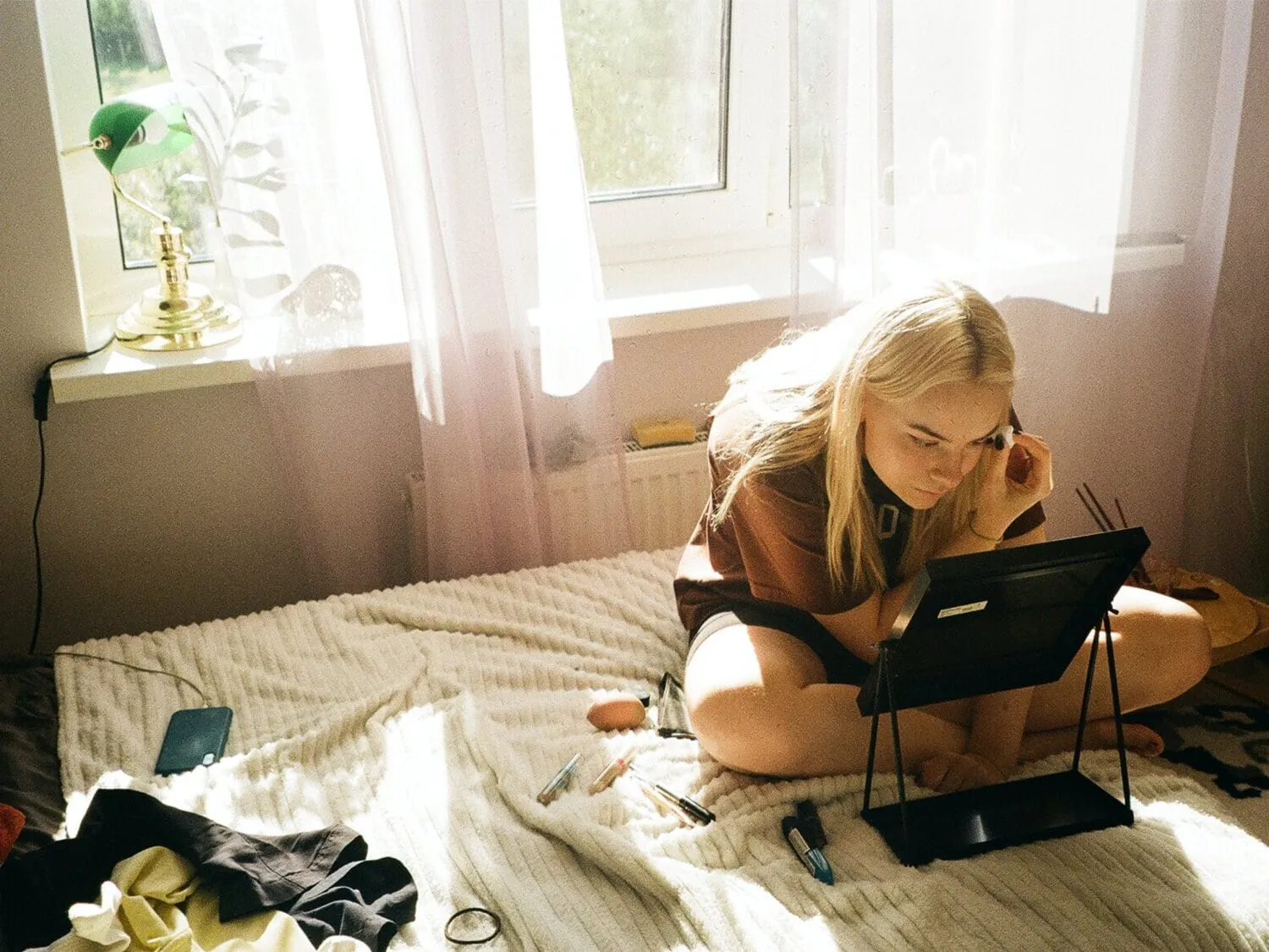 Teenager sat on bed