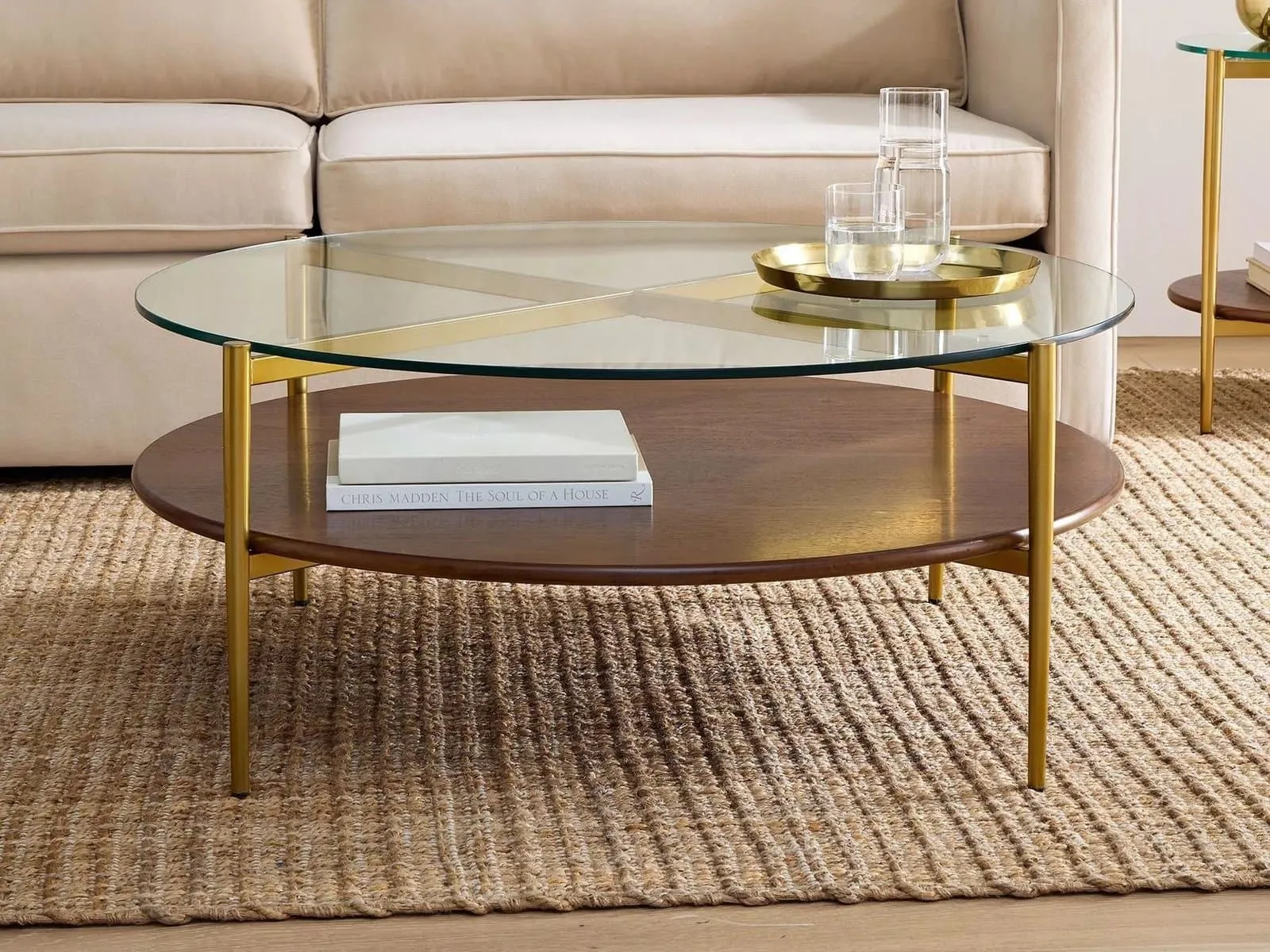 Round glass and walnut coffee table with antique brass frame