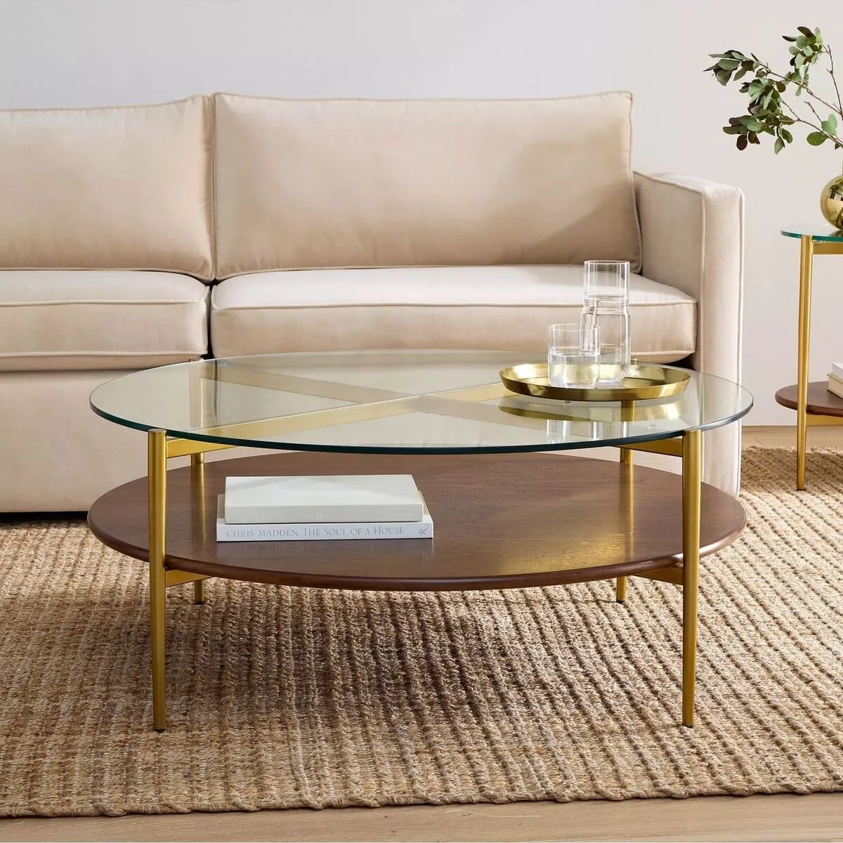 Round glass coffee table with wooden shelf and brass frame